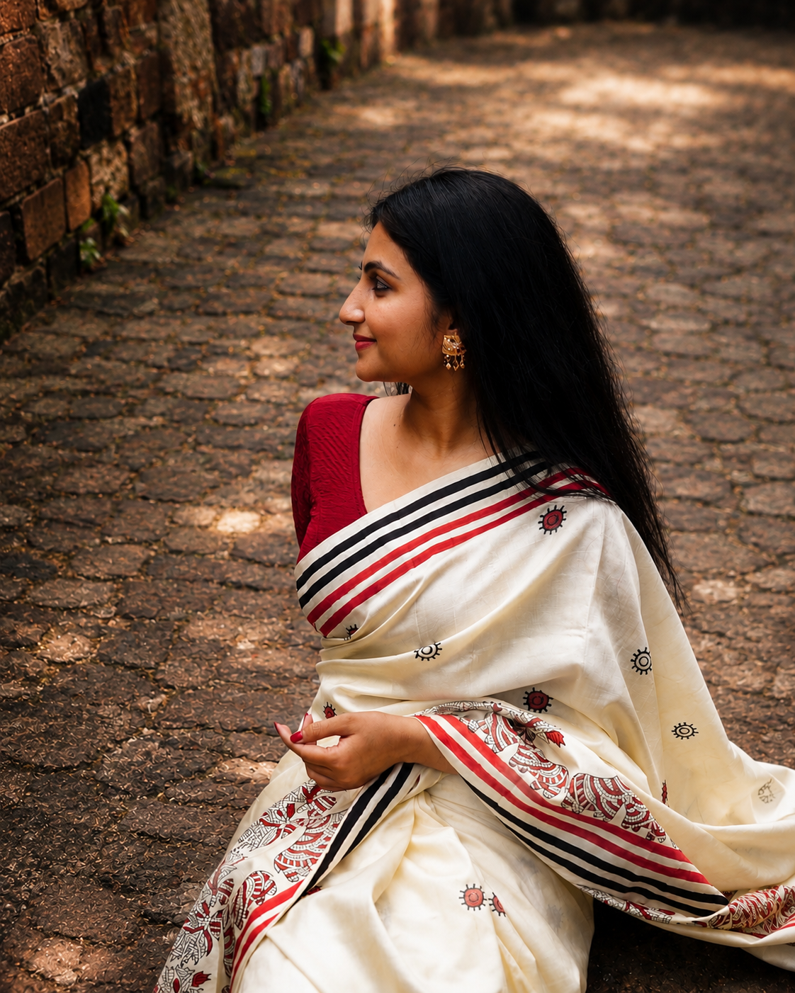 Ivory Pure Silk Saree Side Portrait Look Woman wearing ivory pure silk hand printed saree with traditional border
