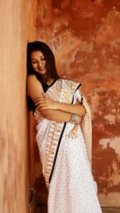 White and mustard hand block printed mul cotton saree with geometric and floral traditional motifs