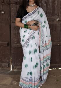 : Hand block printed mul cotton saree with green floral motif and geometric border design