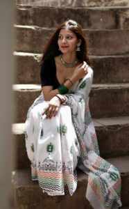 Geometric border detail of hand block printed mul cotton saree with orange and blue patterns