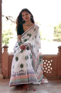 Full-length view of hand block printed mul cotton saree being worn, displaying complete design and length