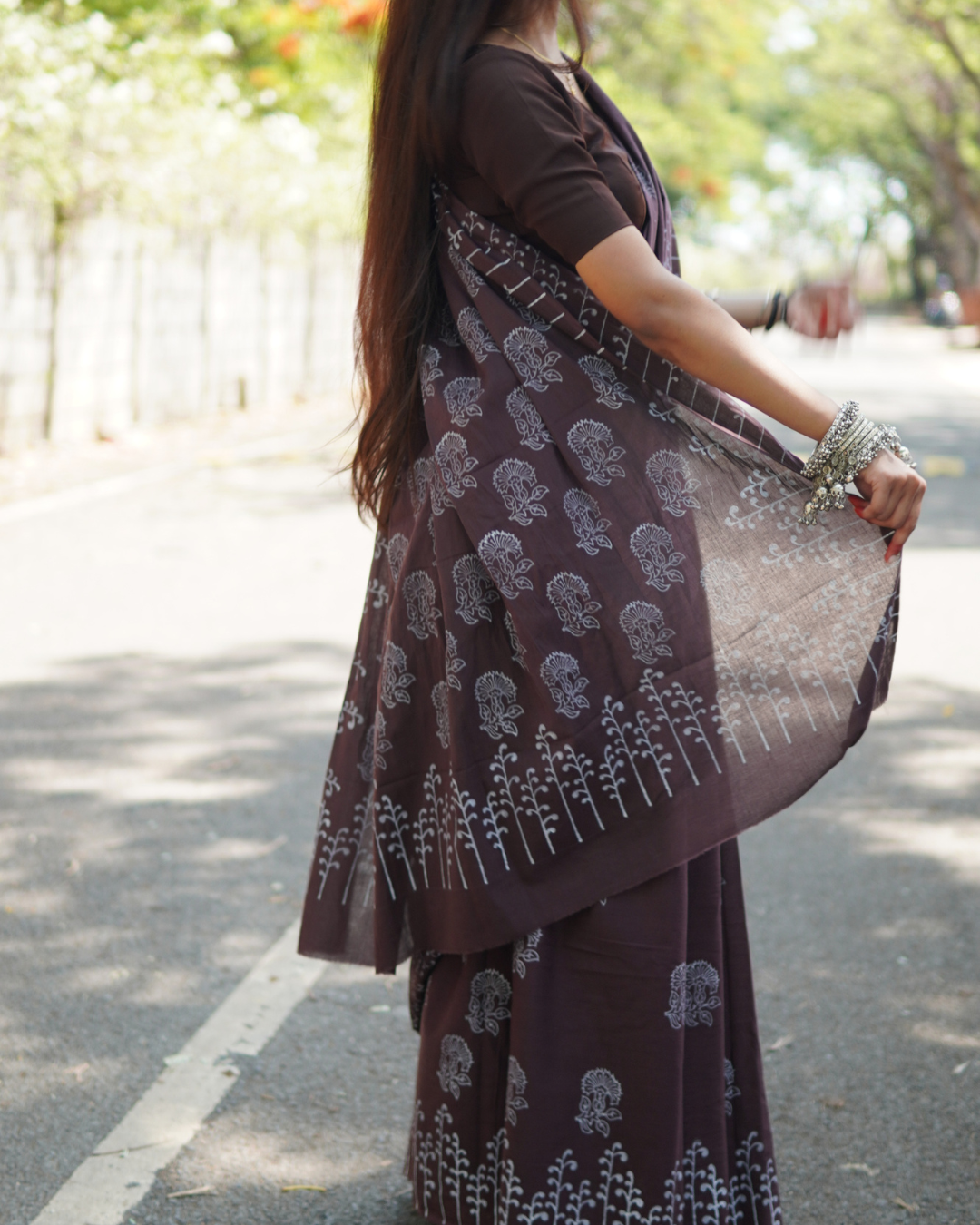 Midnight Plum Hand Block Printed Mul Cotton Saree - Pallu Detail Pallu and border detail of Midnight Plum Hand Block Printed Mul Cotton Saree featuring handcrafted floral motifs