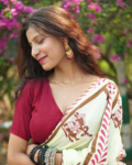 Model wearing Ivory Hand Block Printed Cotton Saree with traditional horse motifs