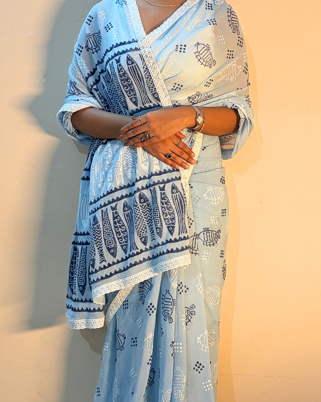 Light blue georgette saree with blue and white printed motifs