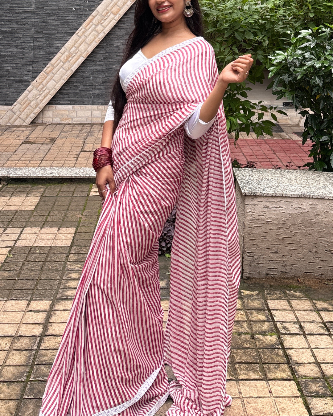 Pink and White Striped Georgette Saree Model wearing pink and white striped Georgette saree