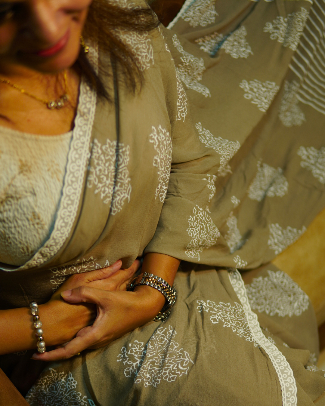 Beige White Floral Georgette Saree Close-Up Beige georgette saree with white floral block prints close-up