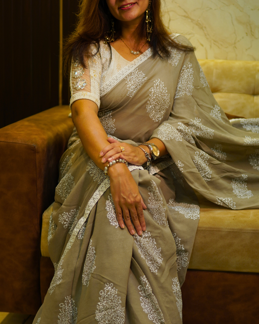 Grey Georgette Saree with Floral Embroidery Grey Georgette saree with white floral motifs and embroidered border
